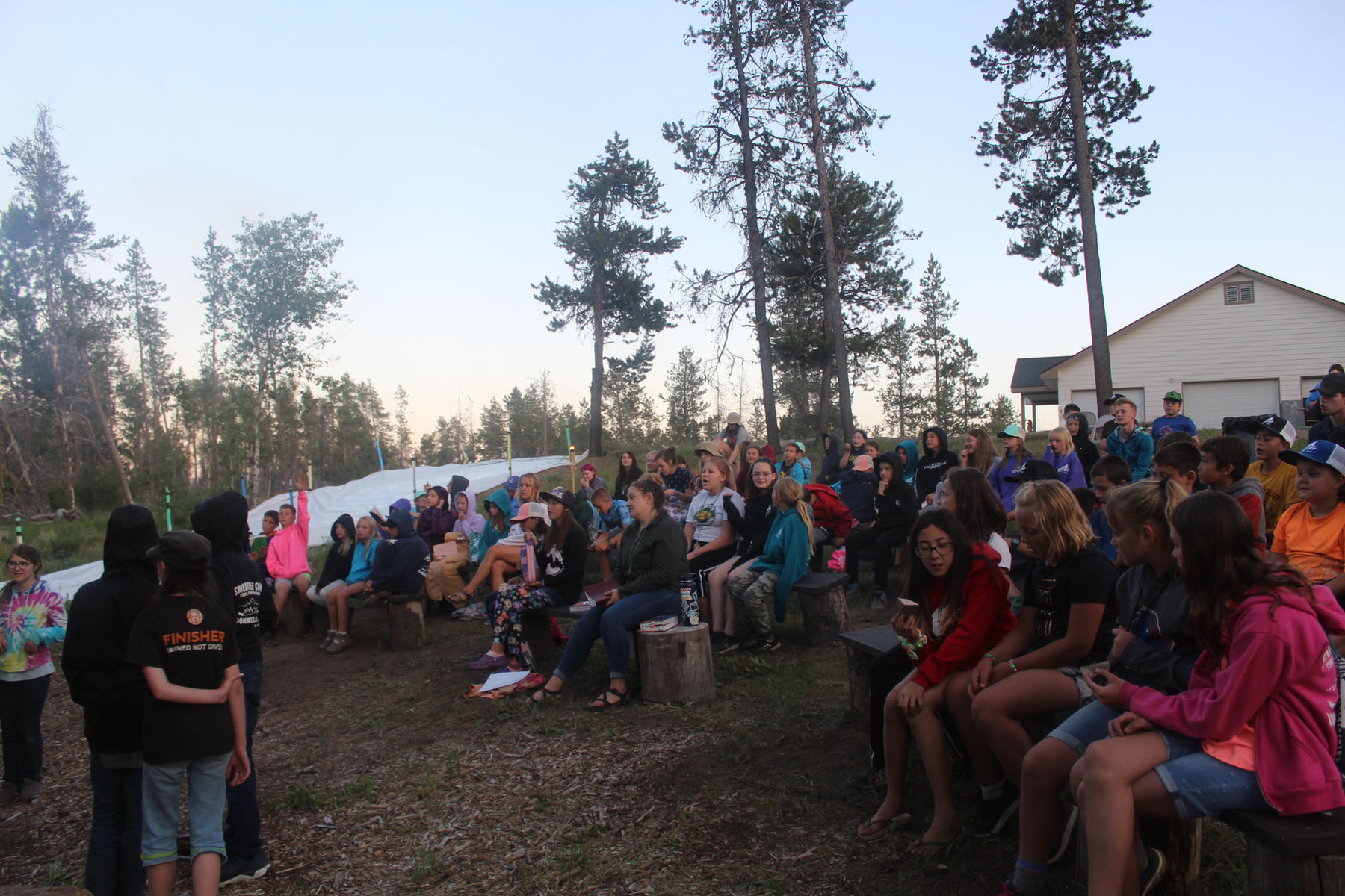 An open Bible during a camp gathering